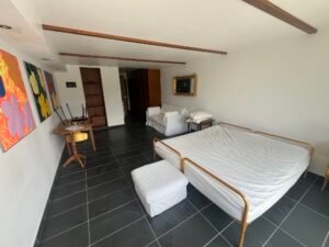 Living room with large windows in Crans-Montana ski studio